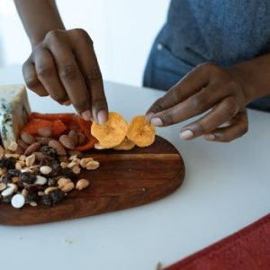 Delicious homemade charcuterie board with assorted snacks, captured indoors.
